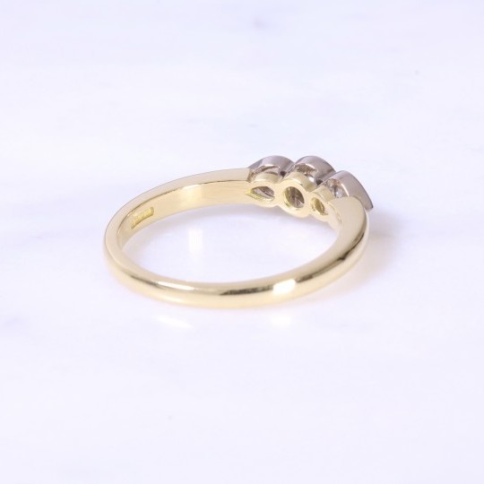 Rub-over Round Brilliant 3 stone Ring with Pear Setting