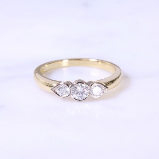 Rub-over Round Brilliant 3 stone Ring with Pear Setting