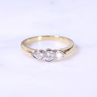 Rub-Over Round Brilliant 3 stone Ring with Pear Setting